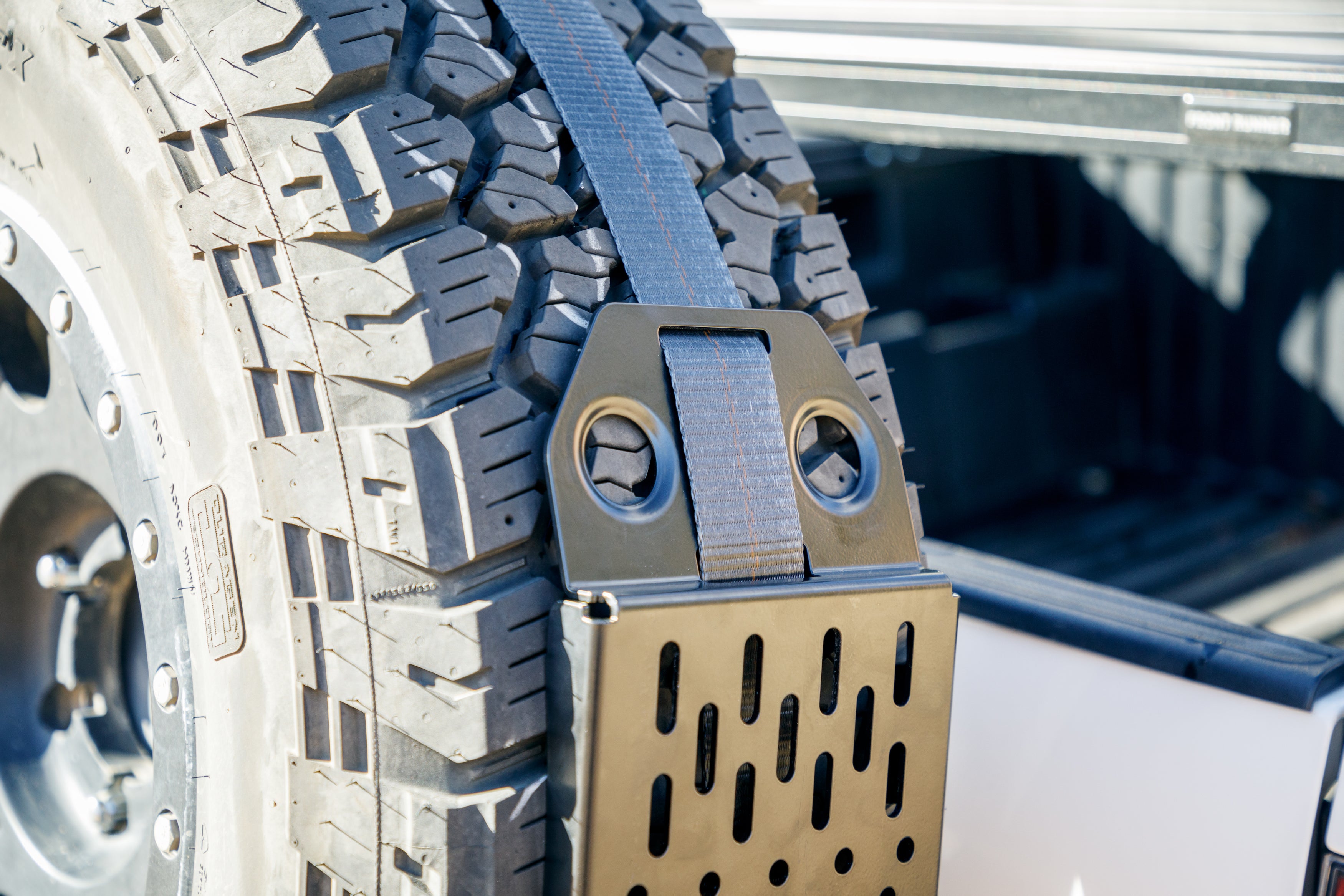Overland Kitted Spare Tire MAXTRAX Mounting System With Mac's Custom Tie Down Strap Detail Shot
